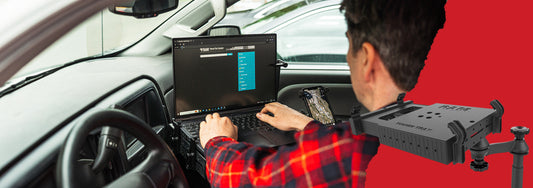 A man using the RAM Tough-Tray in his Chevrolet work truck