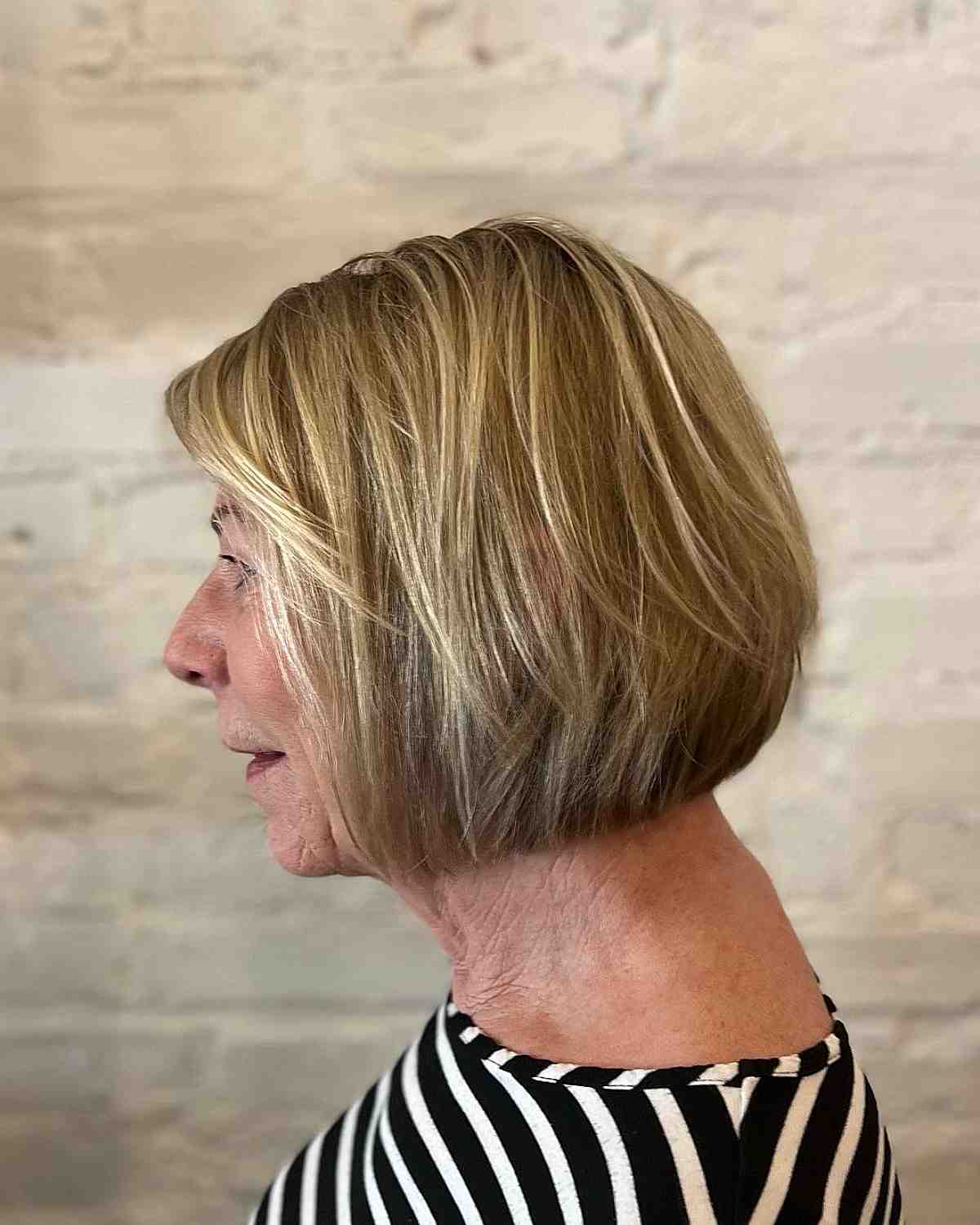 Bob Cut with Wispy Layers for a 60-Year-Old with Fine Hair