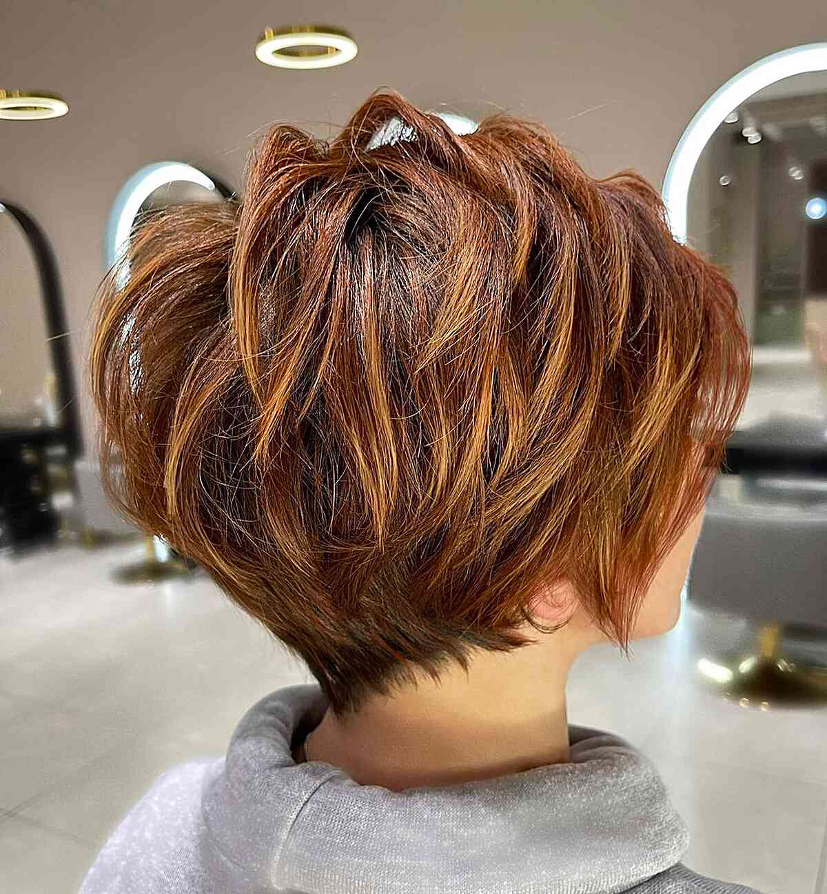Messy Dark Copper Pixie Bob with Layers and a Tapered Nape