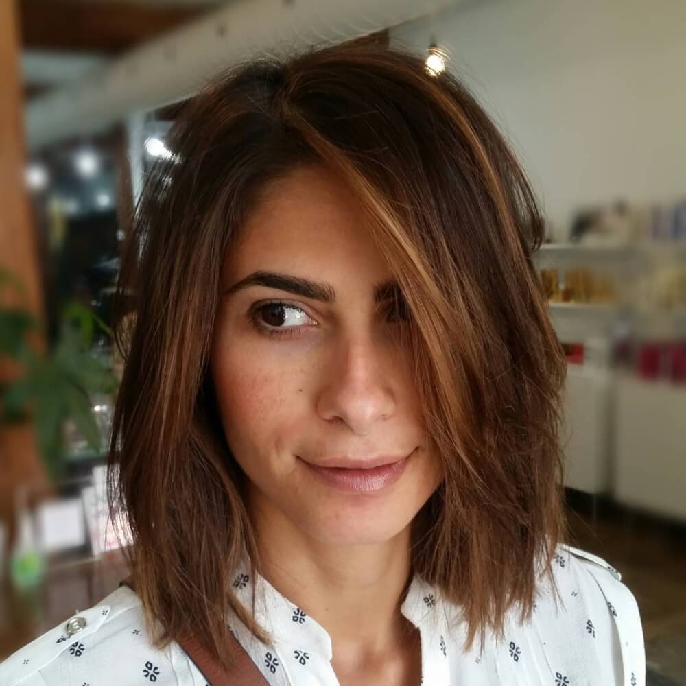 A unique sun-kissed textured lob hairstyle for thin hair