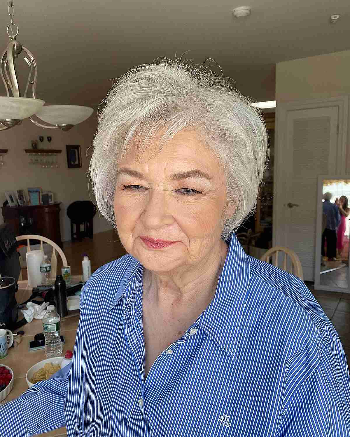 Jaw-Length White Hairstyle with a Side Part for Women 70 and Over