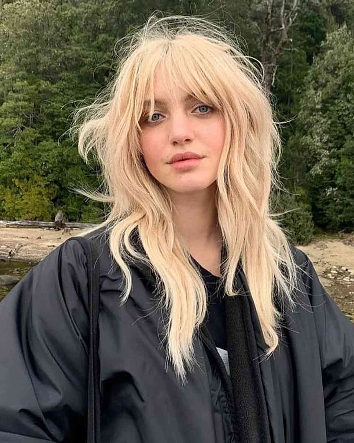 Chest-Length Blonde Wolf Cut with Textured Layers and Bangs