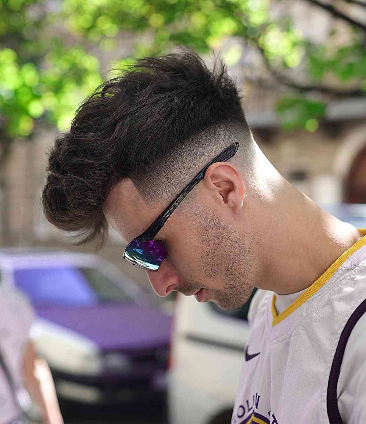 Men's short haircut that's long on top with a drop fade