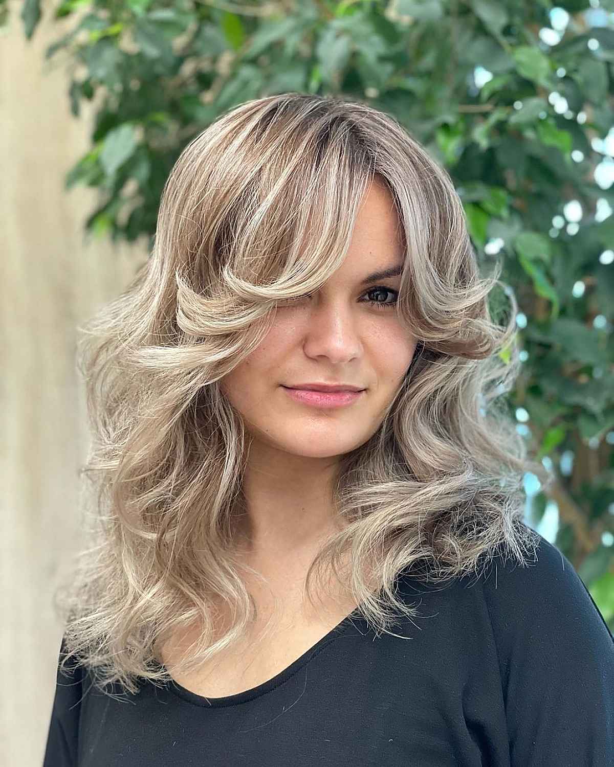 Messy Waves with Face-Framing Feathered Bangs