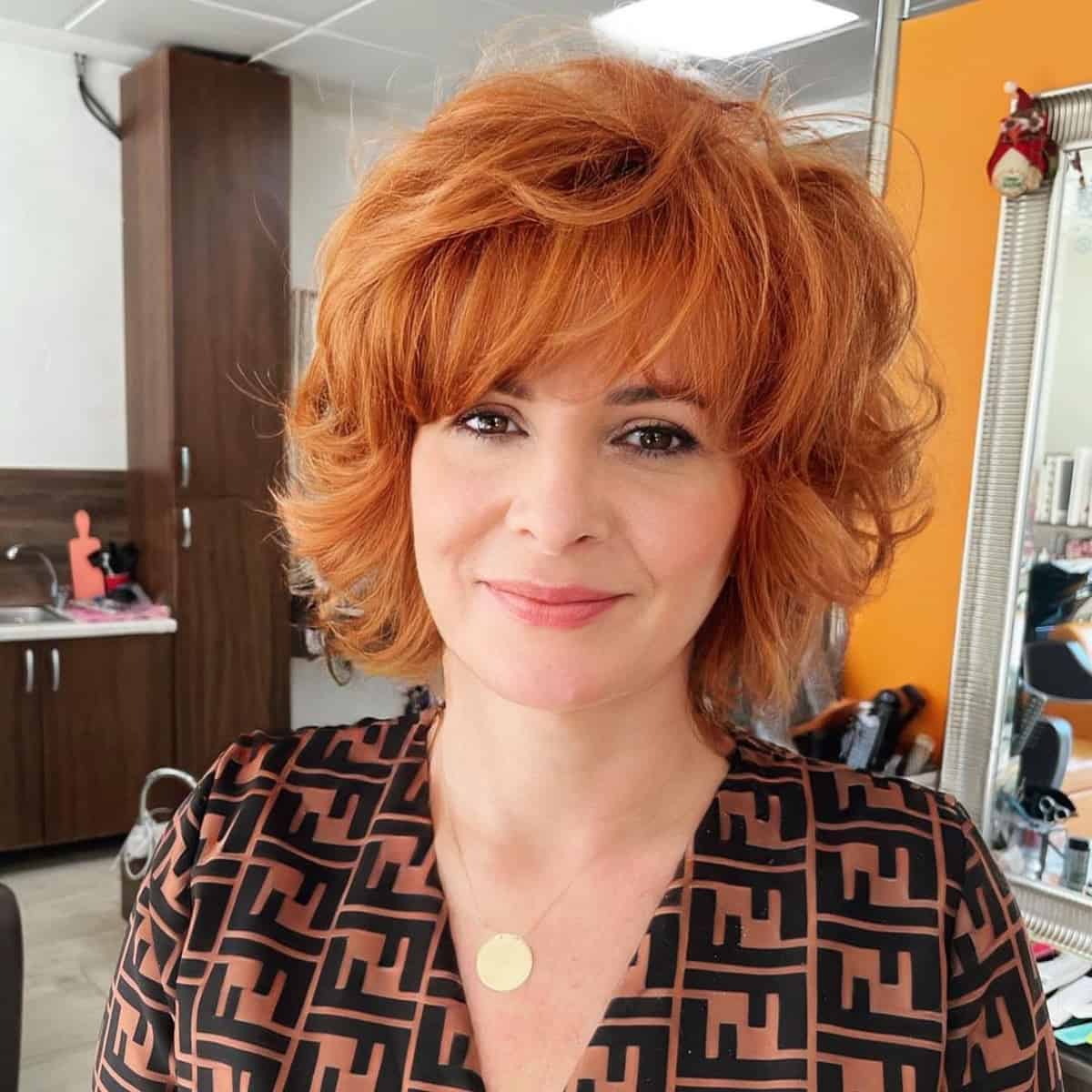Rounded bob with wispy bangs for over 40
