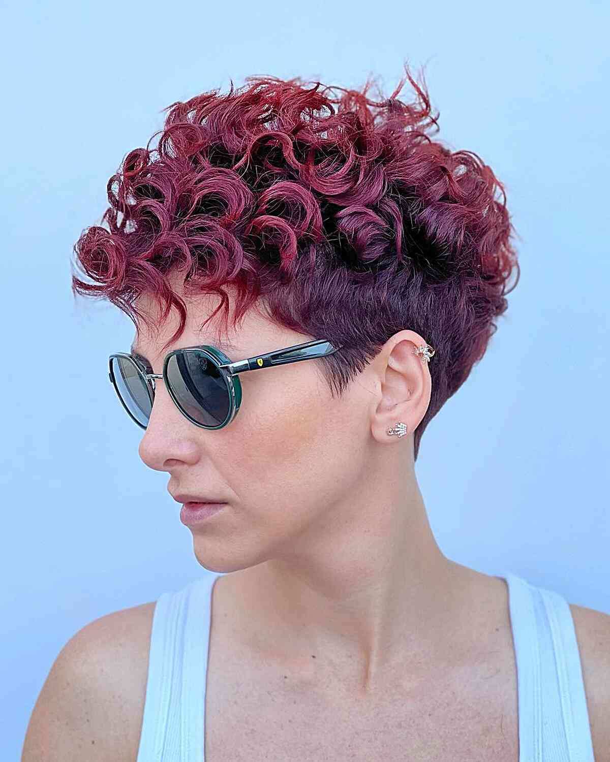 Sexy curly pixie with tapered sides and bangs