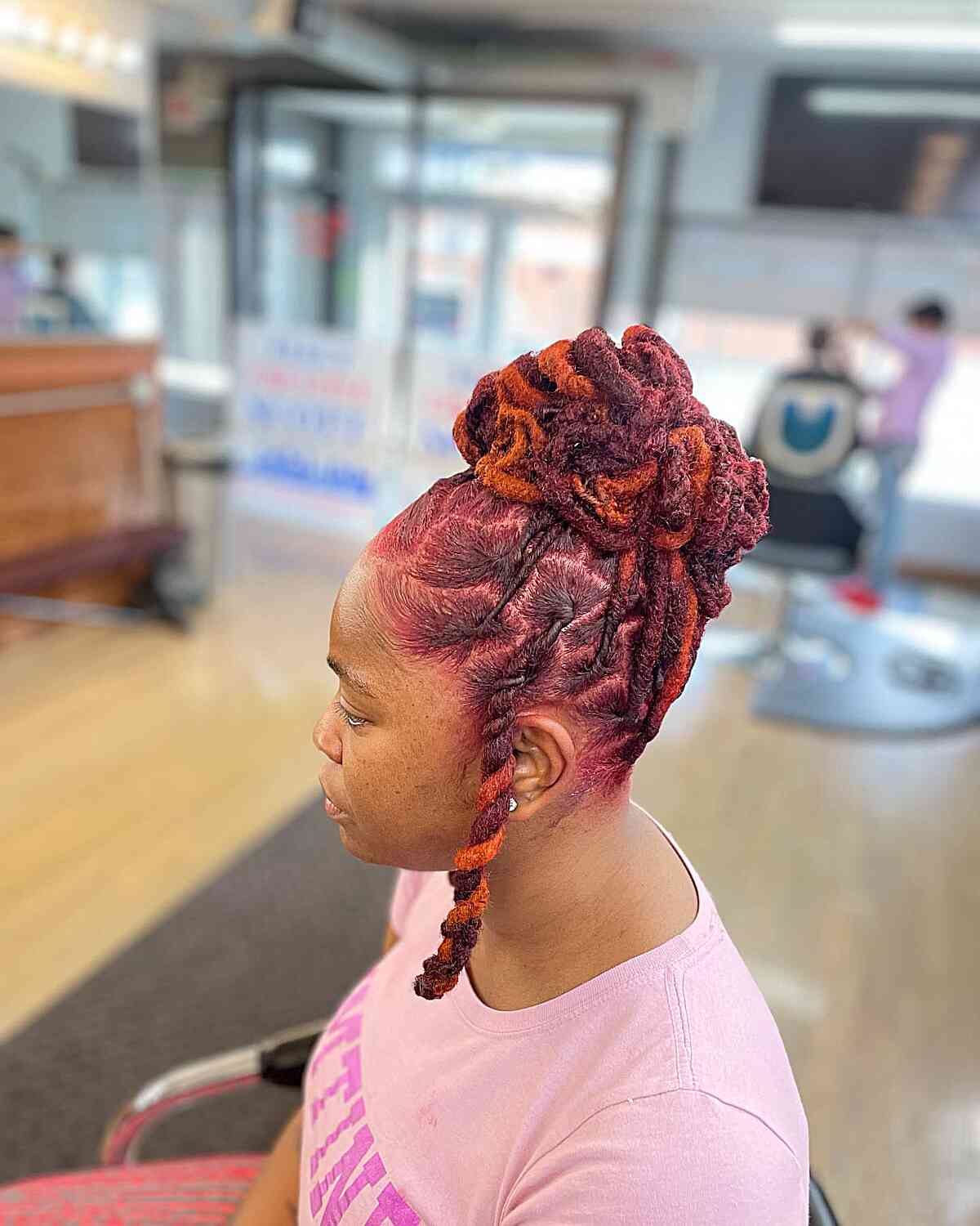 Twisted Knot Updo on Black Women with Red Locs
